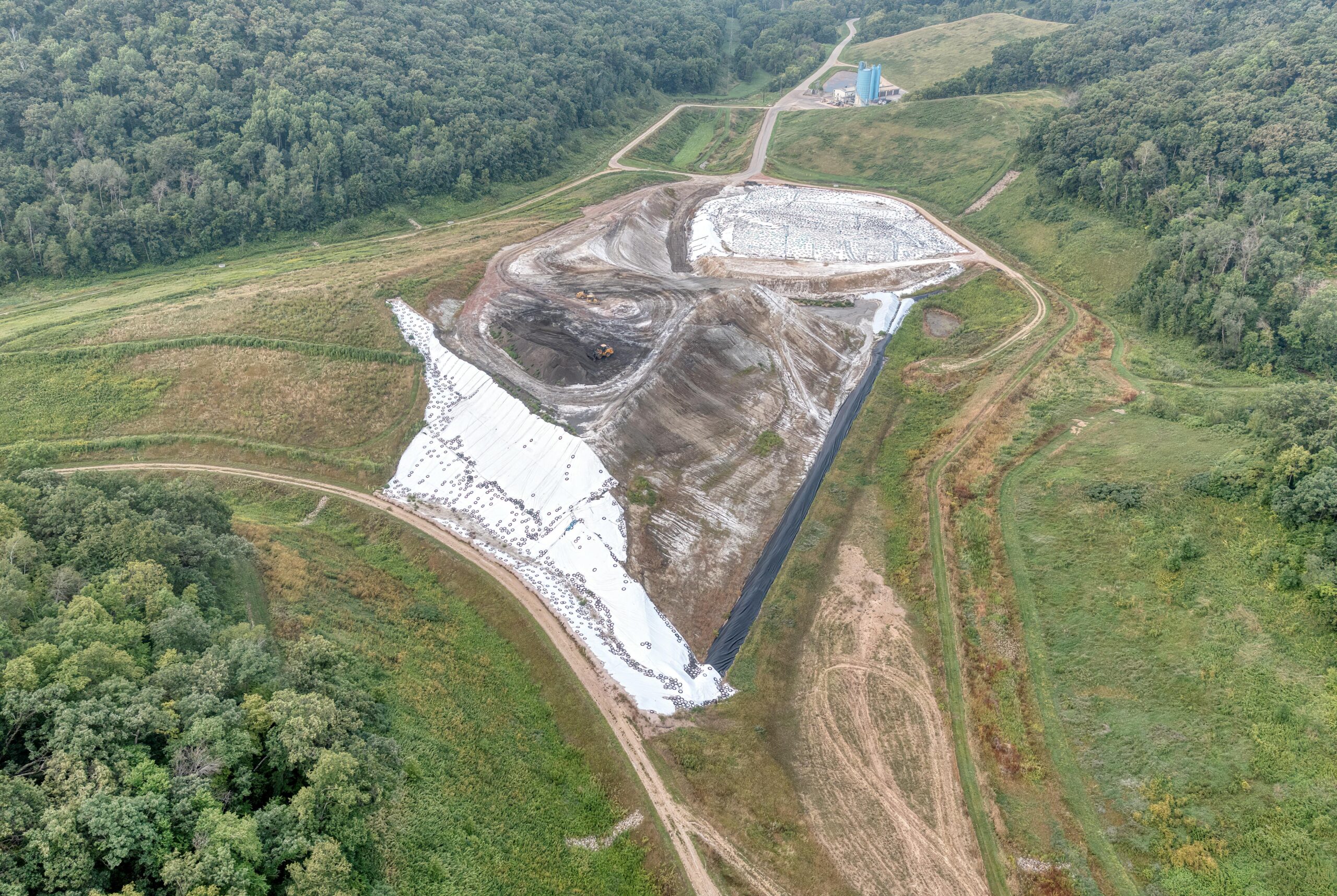 Aerial view of a construction site near Alma, WI, showing landscape and industrial development.